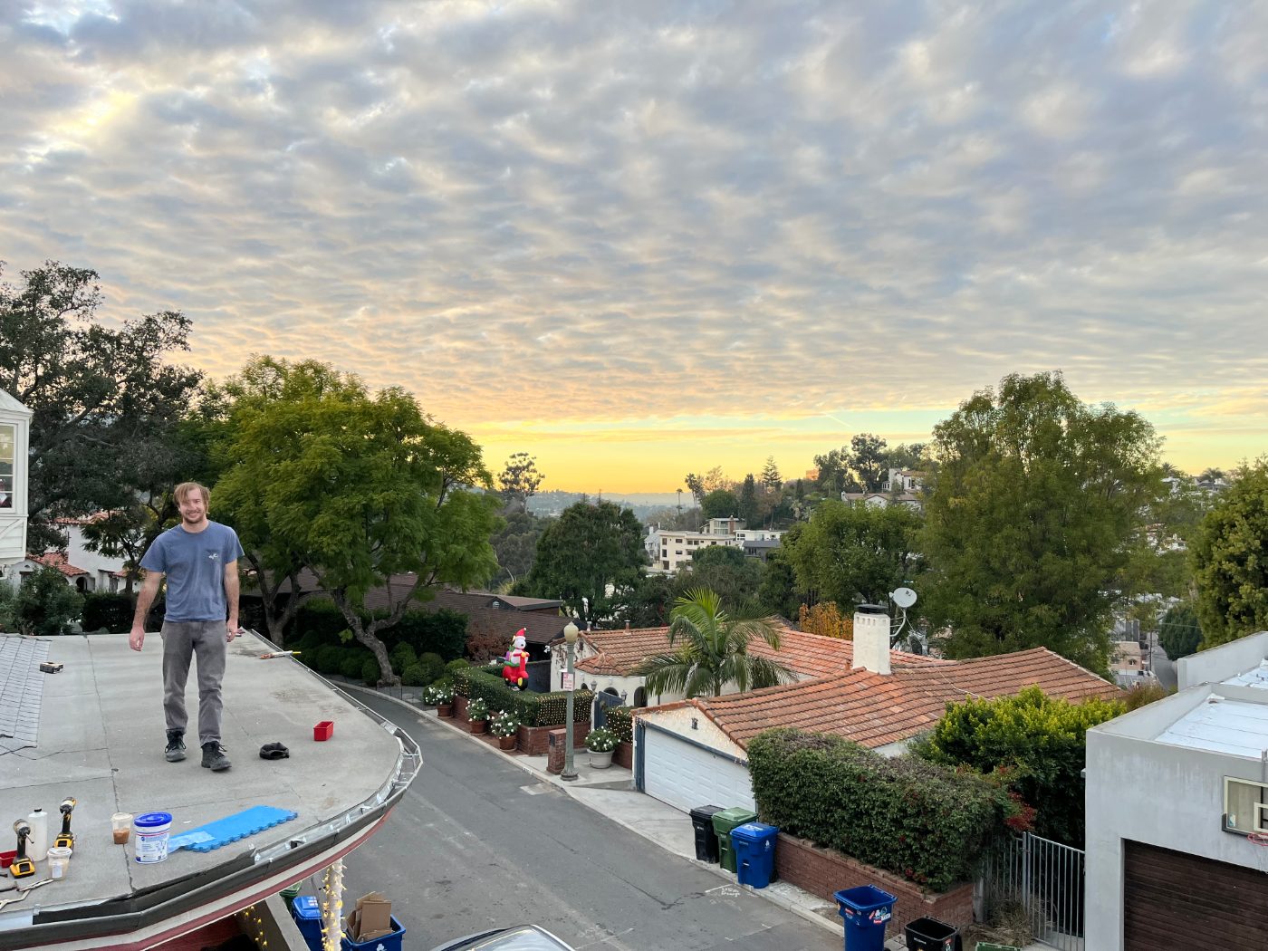 Golden-hour view over a Los Angeles hillside neighborhood served by Rick's Raingutter Service